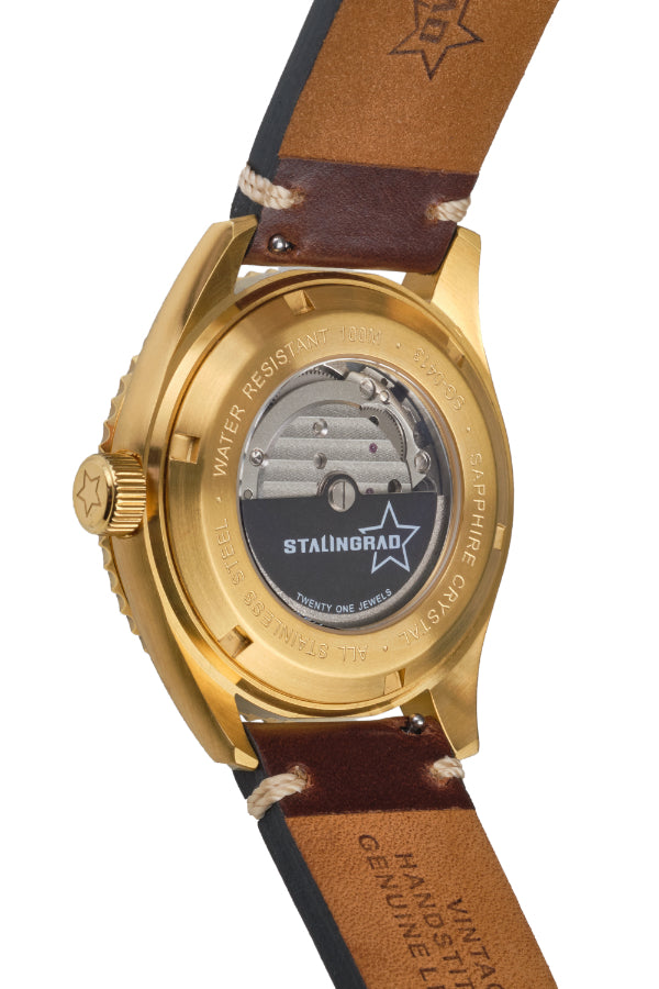 Stalingrad Volga defender automatic watch display caseback with a gold case showing the movement of the watch inside on a white background